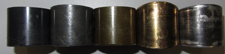 Wear result after test at 30 MPa load. (left to right:) Plastics: iglidur® Q, iglidur® G, iglidur® Z. Metal: Brass, Steel with PTFE liner. The latter two and iglidur® G show varying degrees of length increase