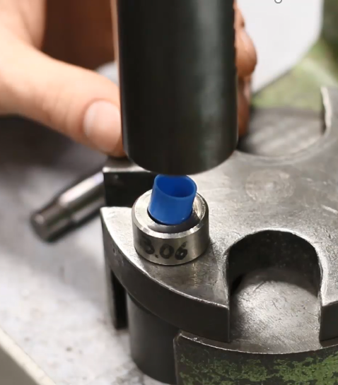 Press-fitting a bushing with a hand press
